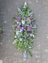 Country Style Casket Spray   Blues and Purples